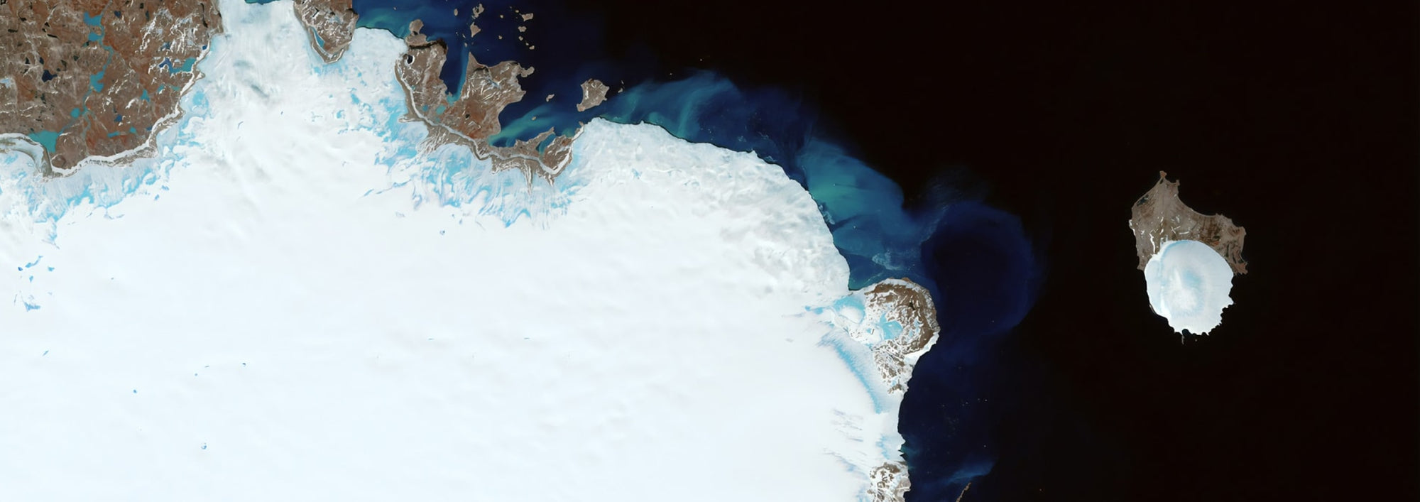 Satelite view of land and dark water