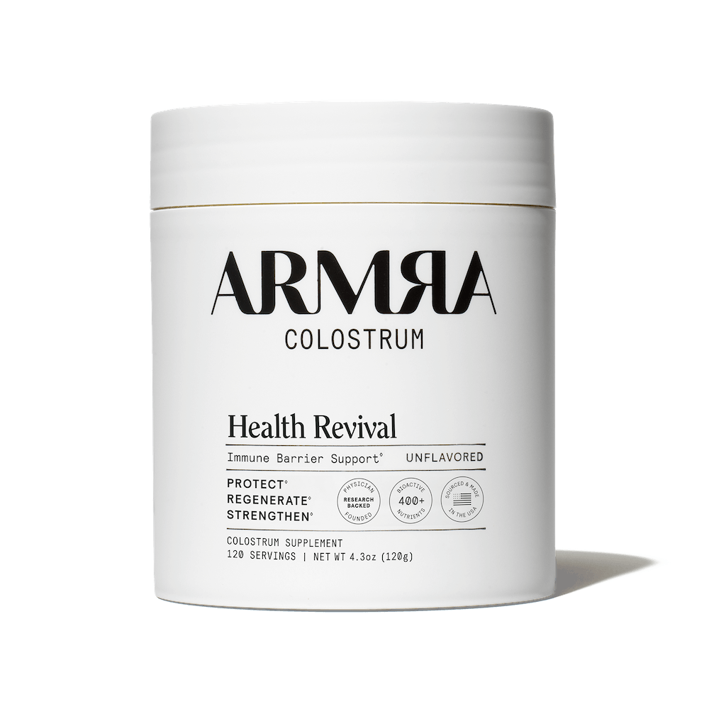 ARMRA Colostrum supplement container on a black background