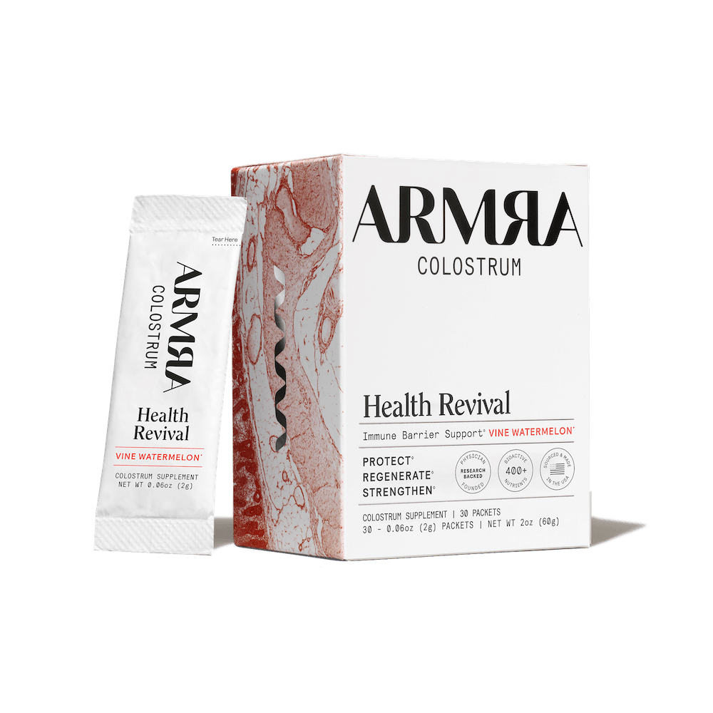 ARMRA Colostrum Health Revival package on a black background
